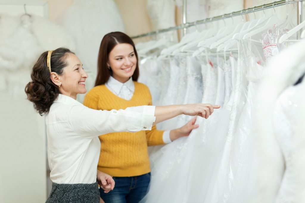 woman choosing bridal gown