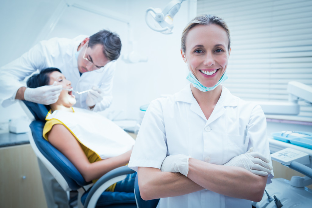 dental patient in chair with dntists
